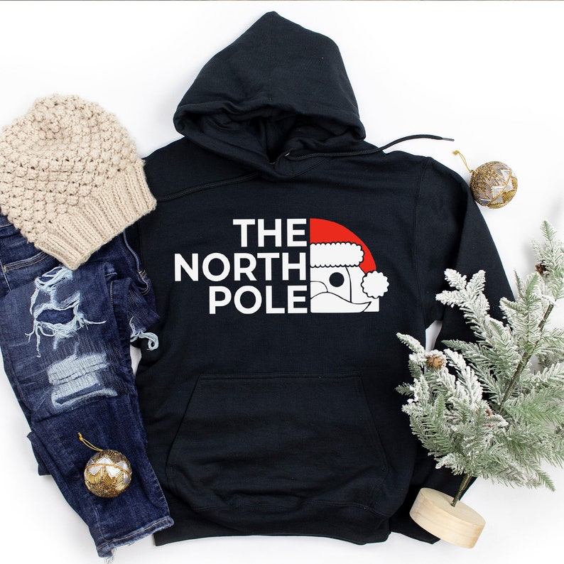 HOODIES (5226 ) The NORTH Pole Merry Christmas Xmas Santa Elf Christmas -Youth Hoodies No drawstring to conform to EU regulations.