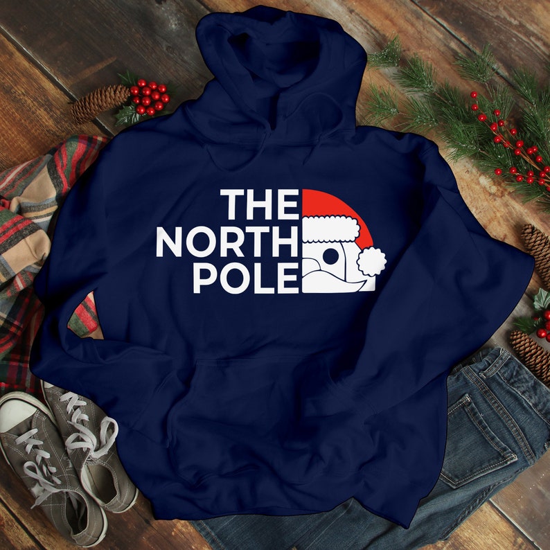 HOODIES (5226 ) The NORTH Pole Merry Christmas Xmas Santa Elf Christmas -Youth Hoodies No drawstring to conform to EU regulations.