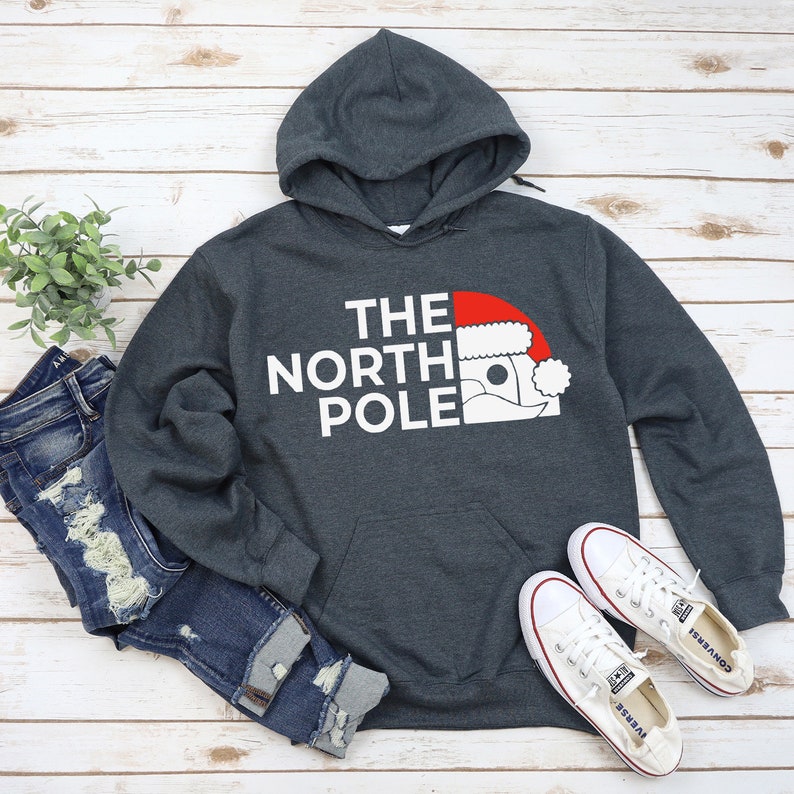 HOODIES (5226 ) The NORTH Pole Merry Christmas Xmas Santa Elf Christmas -Youth Hoodies No drawstring to conform to EU regulations.