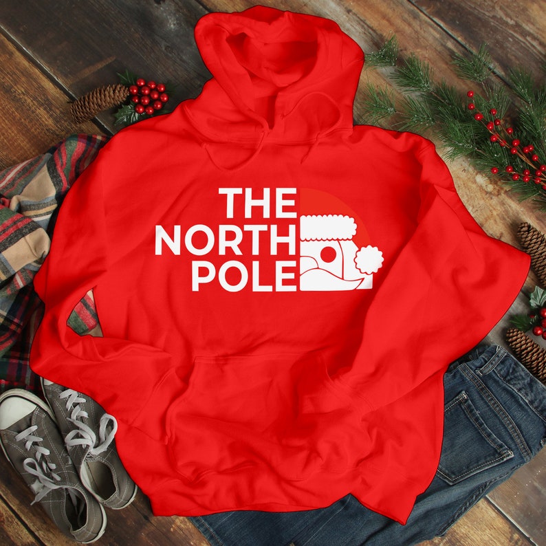 HOODIES (5226 ) The NORTH Pole Merry Christmas Xmas Santa Elf Christmas -Youth Hoodies No drawstring to conform to EU regulations.