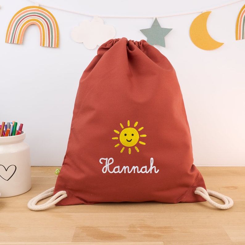 Rust-colored organic children's gym bag personalized with name