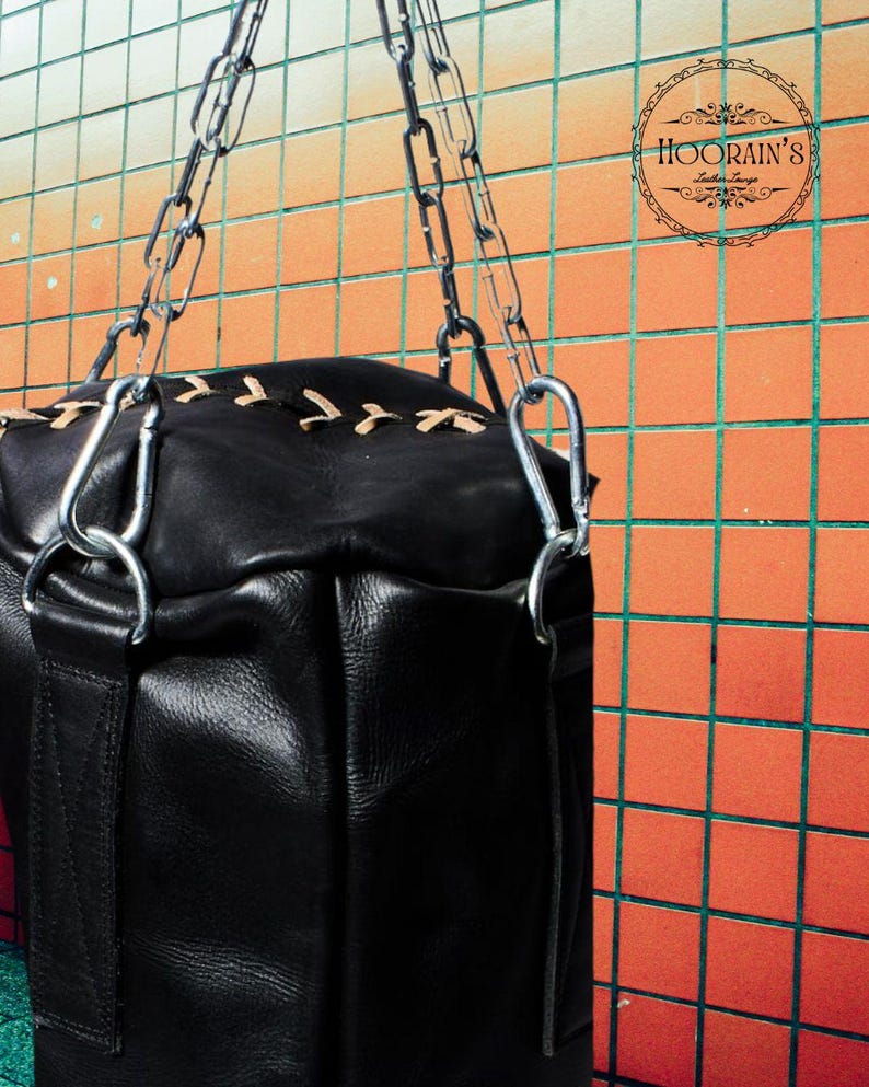 Handcrafted Black Leather Punching Bag – Durable Cowhide Training and Boxing Bag Perfect for MMA, Kickboxing, and Intense Gym Workouts.