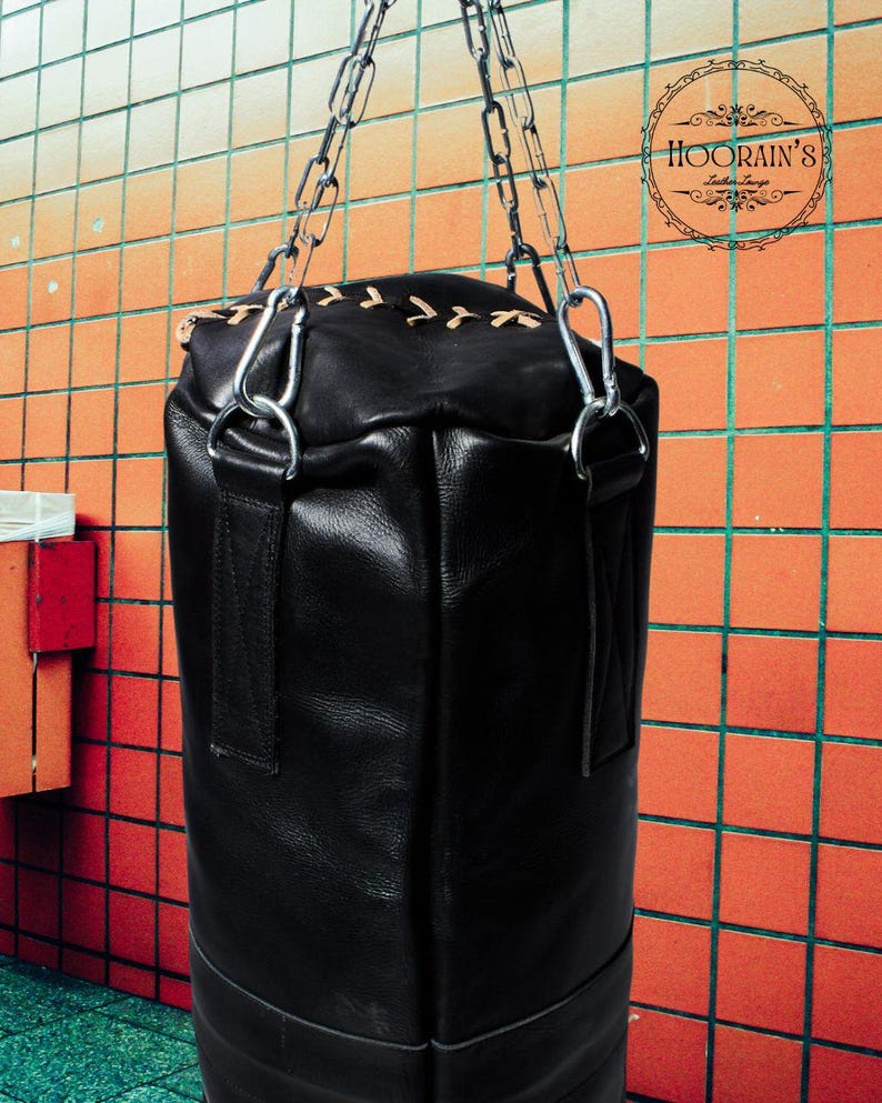 Handcrafted Black Leather Punching Bag – Durable Cowhide Training and Boxing Bag Perfect for MMA, Kickboxing, and Intense Gym Workouts.