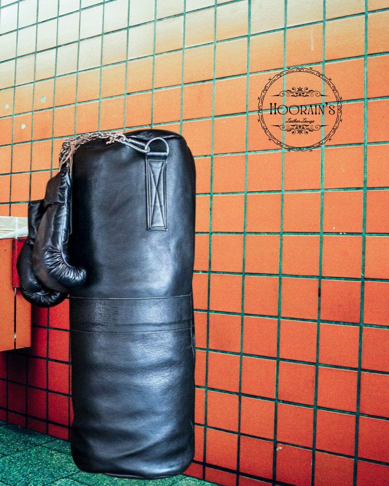 Handcrafted Black Leather Punching Bag – Durable Cowhide Training and Boxing Bag Perfect for MMA, Kickboxing, and Intense Gym Workouts.